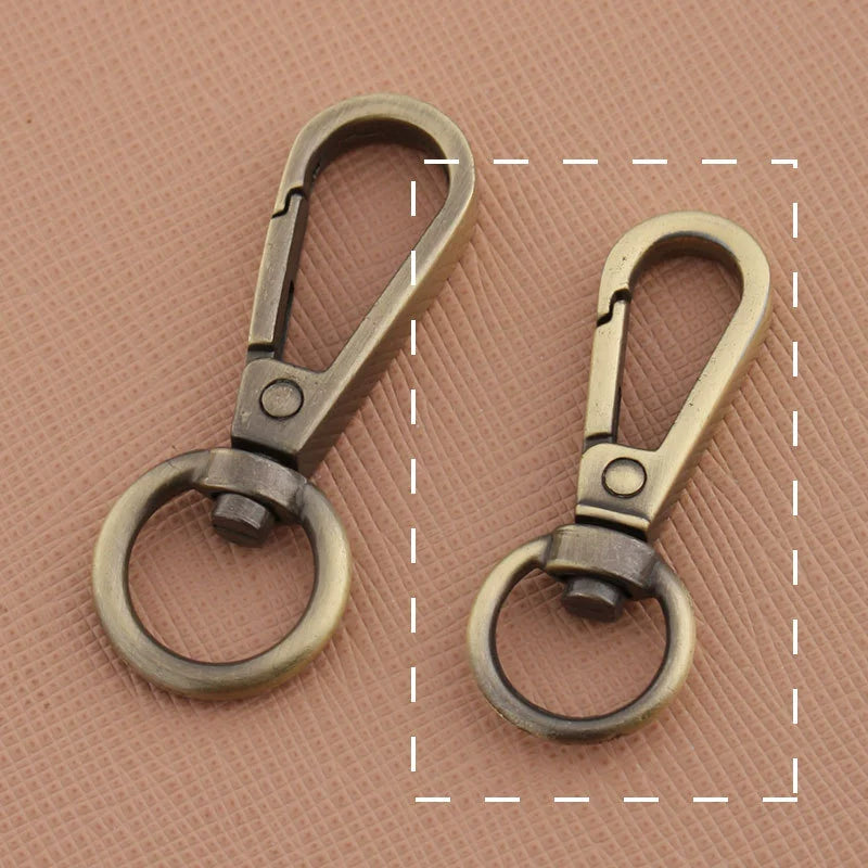 Swivel lobster claw hook buckle hardware, two antique gunmetal-tone hooks with circular rings