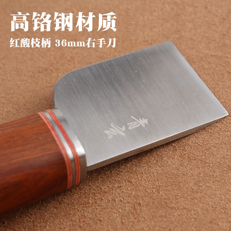 Thumb knife 36mm blade close-up with engraved marks and rosewood handle, silver ring