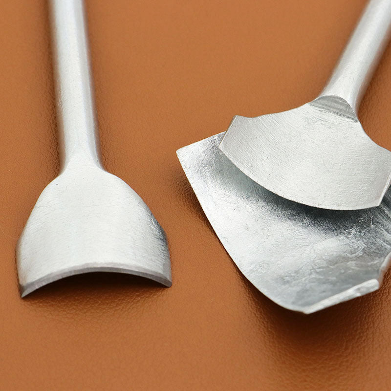 Two silver corner punch heads with curved blades on long handles