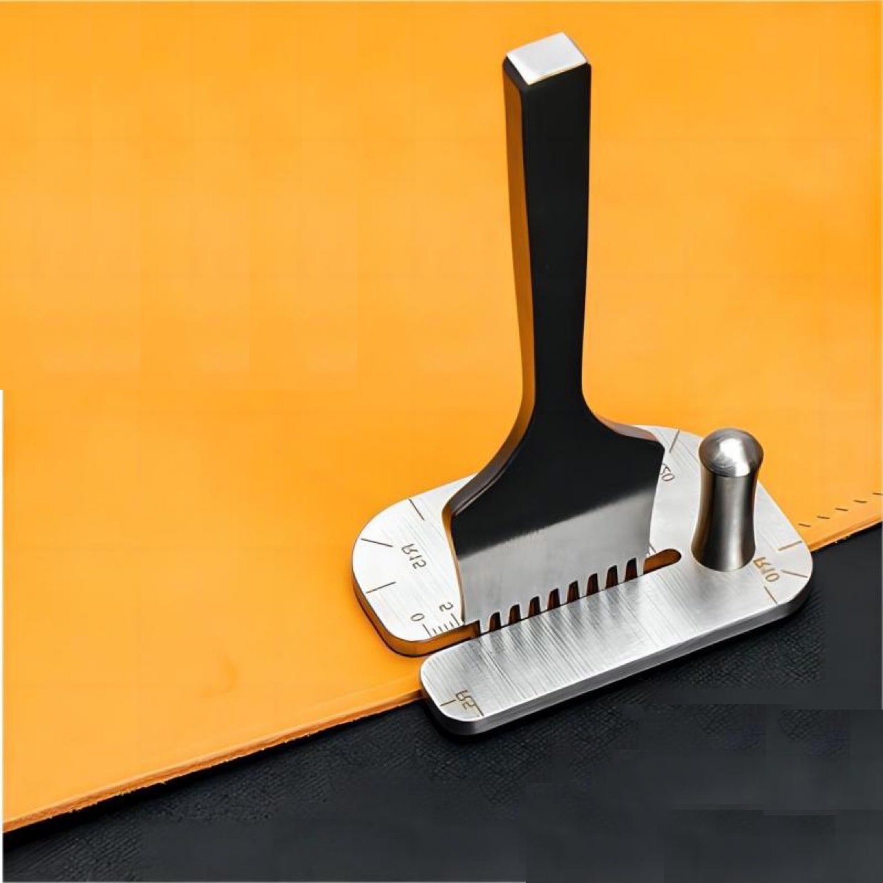 Leather stitching punch aid tool with metal base, black handle, and measuring scale