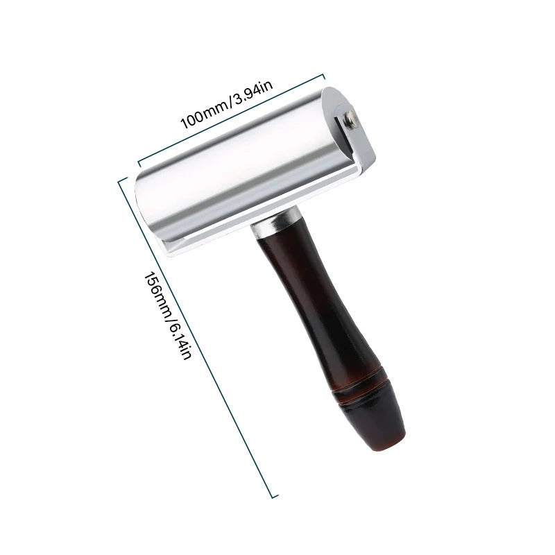 Leather roller press with dark wooden handle, 100mm chrome roller