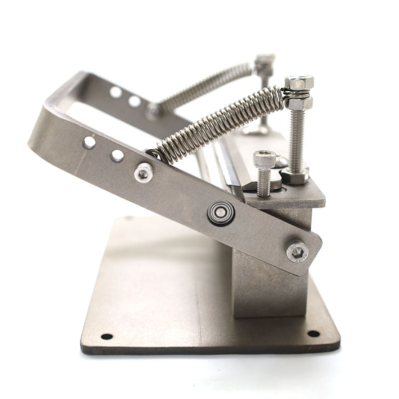 Metal strap splitter press with spring-loaded clamps and guide plate
