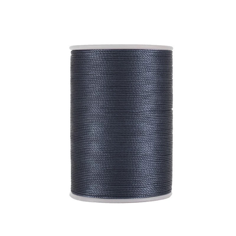 Waxed leather stitching thread spool with dark blue thread