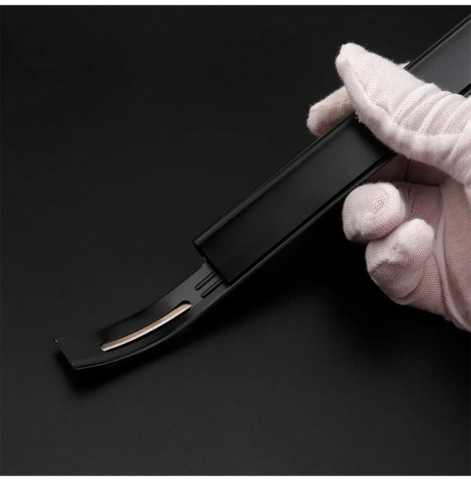 Black leather safety beveler with blade insert, gripped with a white glove