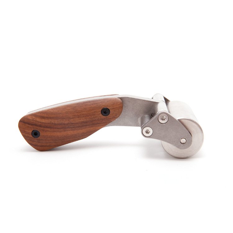 Leather roller tool with curved metal head and wooden handle