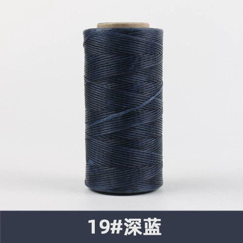 Waxed polyester sewing thread spool, dark navy blue