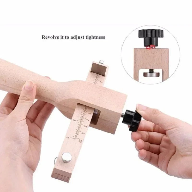 Leather strap cutter with black adjustment knob and wooden tightening slider