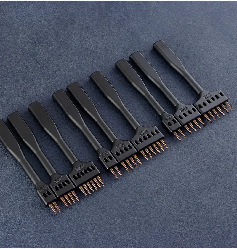 Row of black hole punching tools with copper prongs and perforation blocks