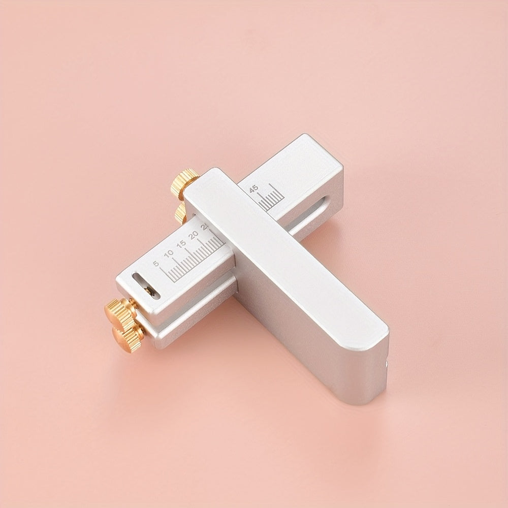 Aluminum strap cutter with wide handle, engraved measuring scales, and brass knobs