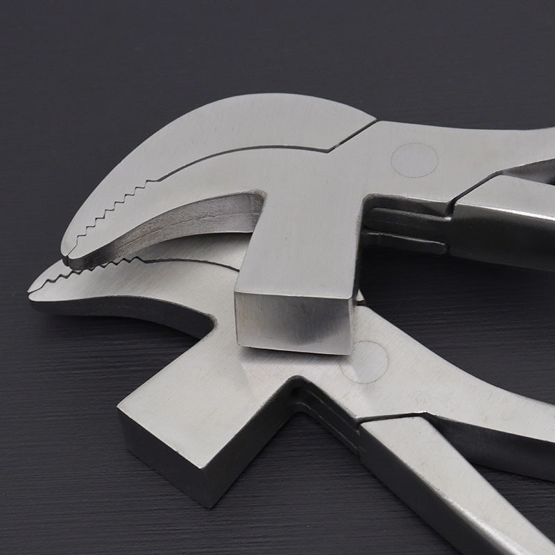 Stainless steel bird-nose pliers close-up of serrated jaws and hinge area