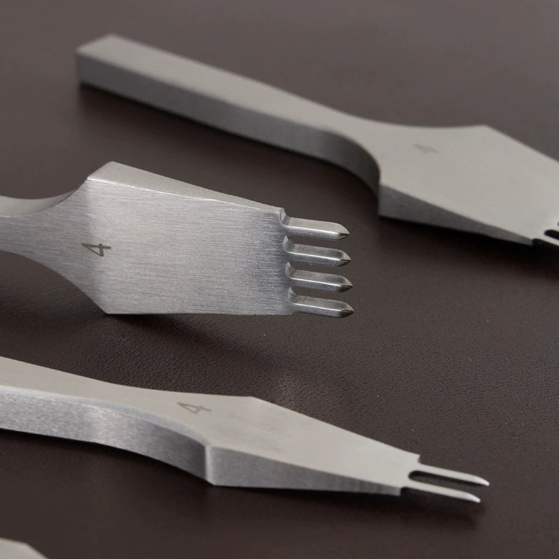 Leather hole punch chisels, close view of four-tine cutting tips marked 4