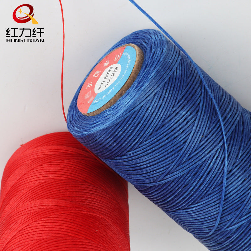 Waxed polyester sewing thread spools, blue and red close-up