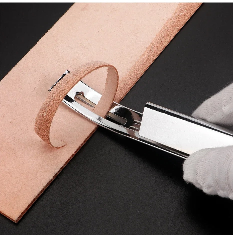 Leather safety beveler beveling a tan leather edge with a silver cutting guard