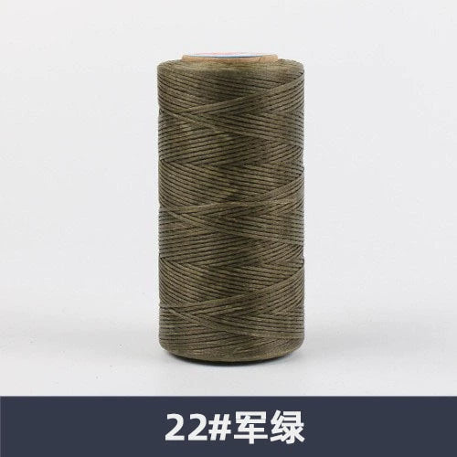 Waxed polyester sewing thread spool, olive green