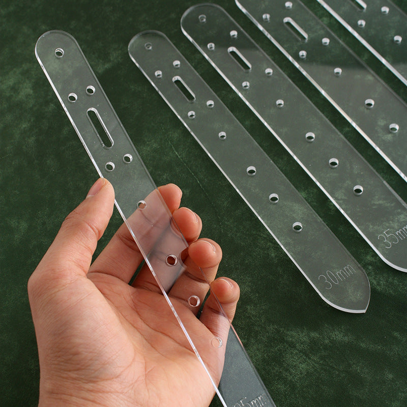 Acrylic belt hole templates: clear strips with drilled holes and long slot for positioning