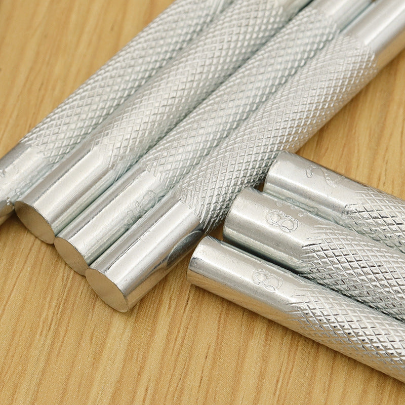 Silver textured punch rods for snap fasteners, close-up of metal tips