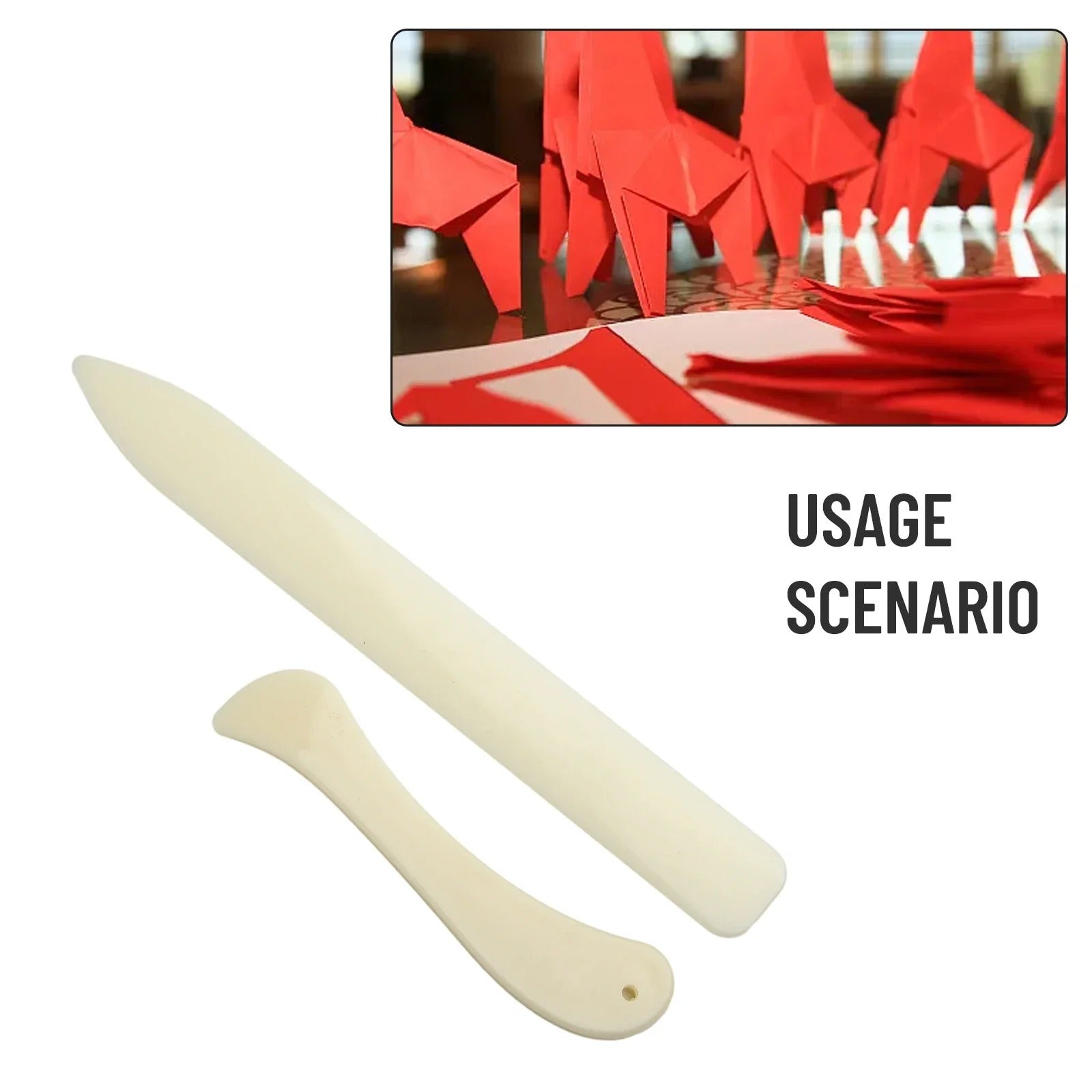 Two cream leather bone folders with rounded ends and small hole details