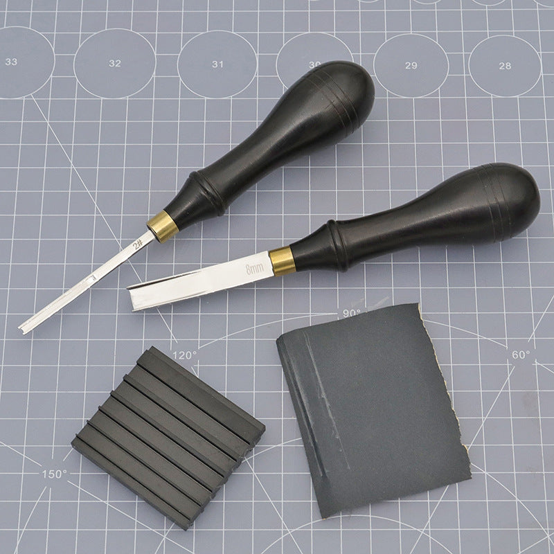 Knife repair tool with two bevel knives, black sharpener inserts, and square stone