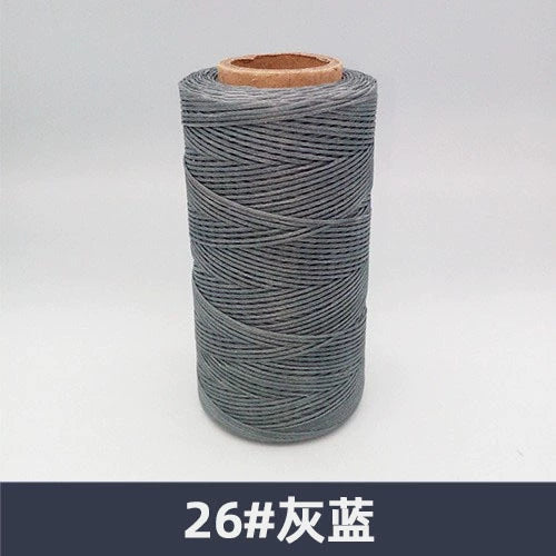Waxed polyester sewing thread spool, grayish blue