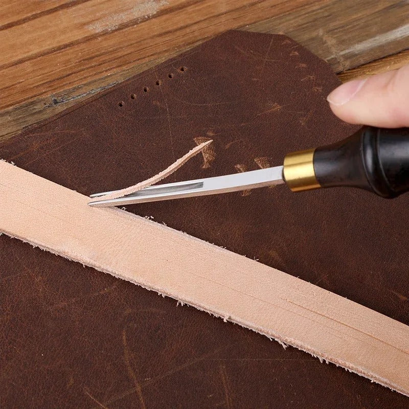 Leather skiving beveler shaving blade making a shallow cut