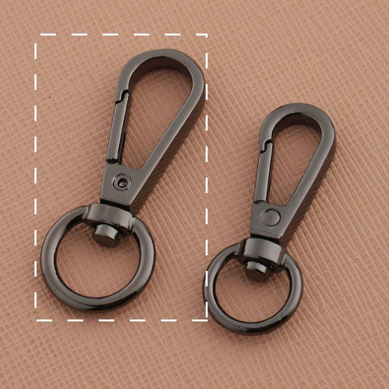 Swivel lobster claw hook buckle hardware, two dark gunmetal-tone hooks with swivel rings