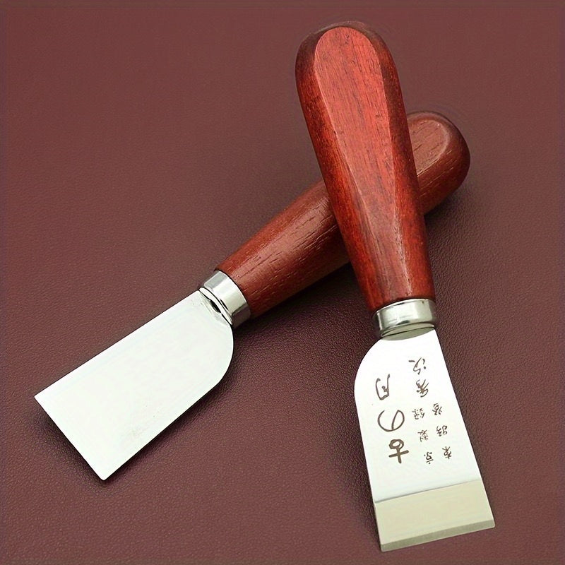 Leather cutting knife with curved wooden handle and flat steel cutting blade