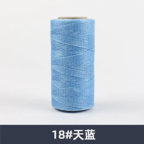 Waxed polyester sewing thread spool, light blue, flat 150D, 260 m