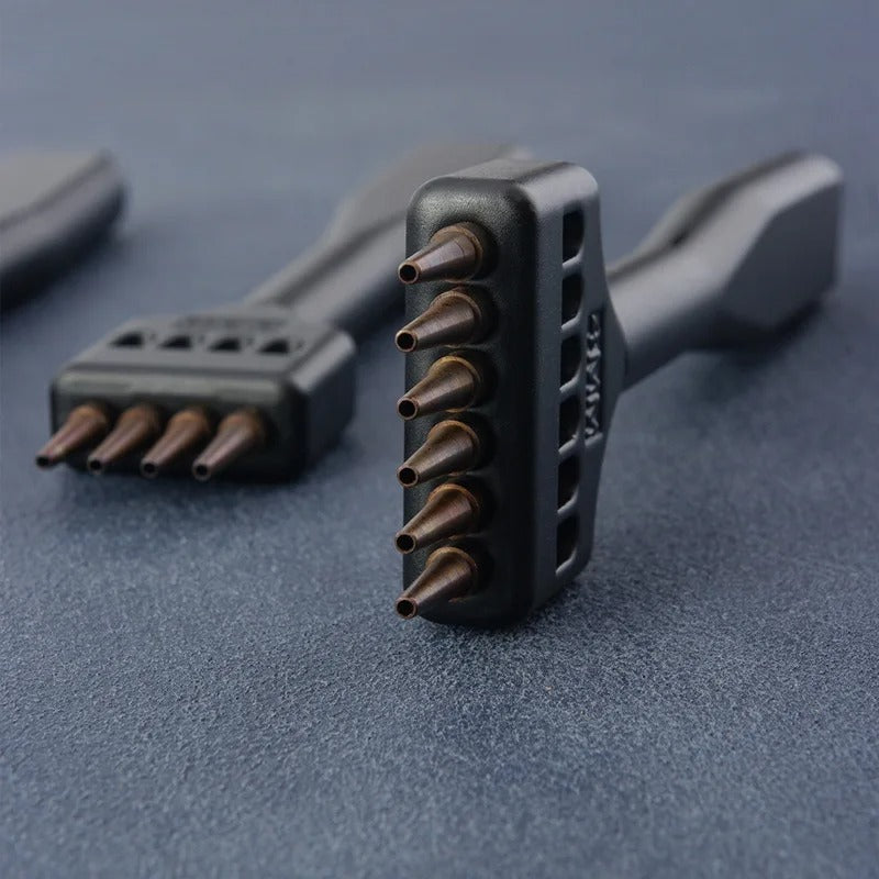 Black round hole punch tool set, side view of three heads and copper pins