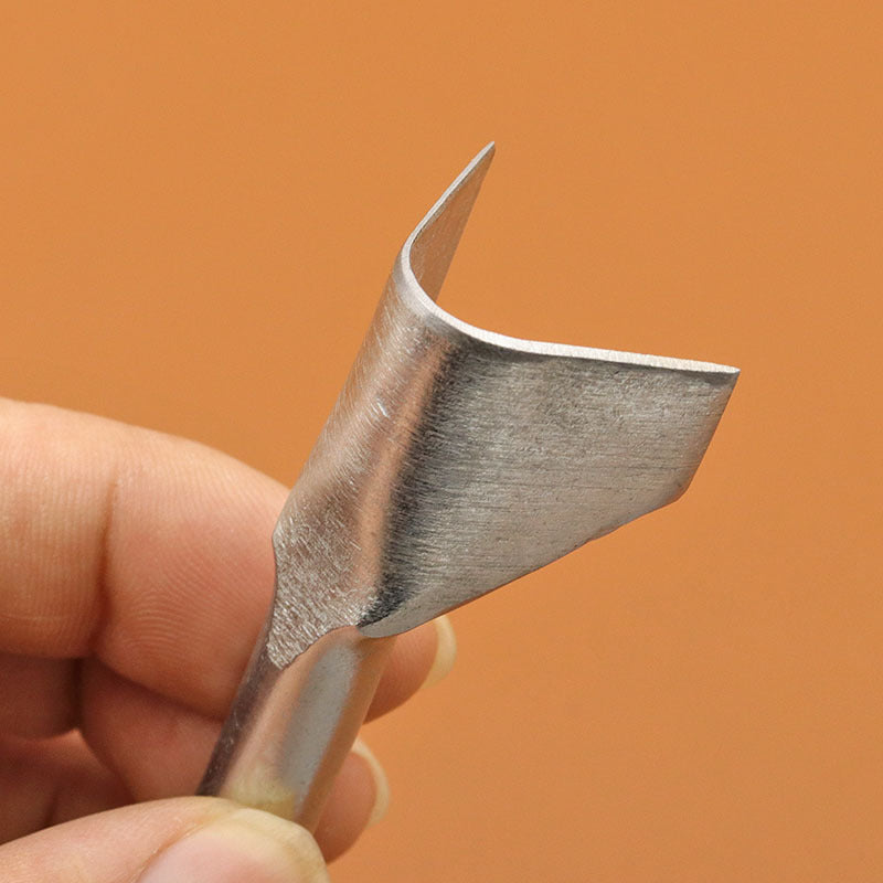 V-shaped leather edge punch held in hand, pointed V tip for leather edging.