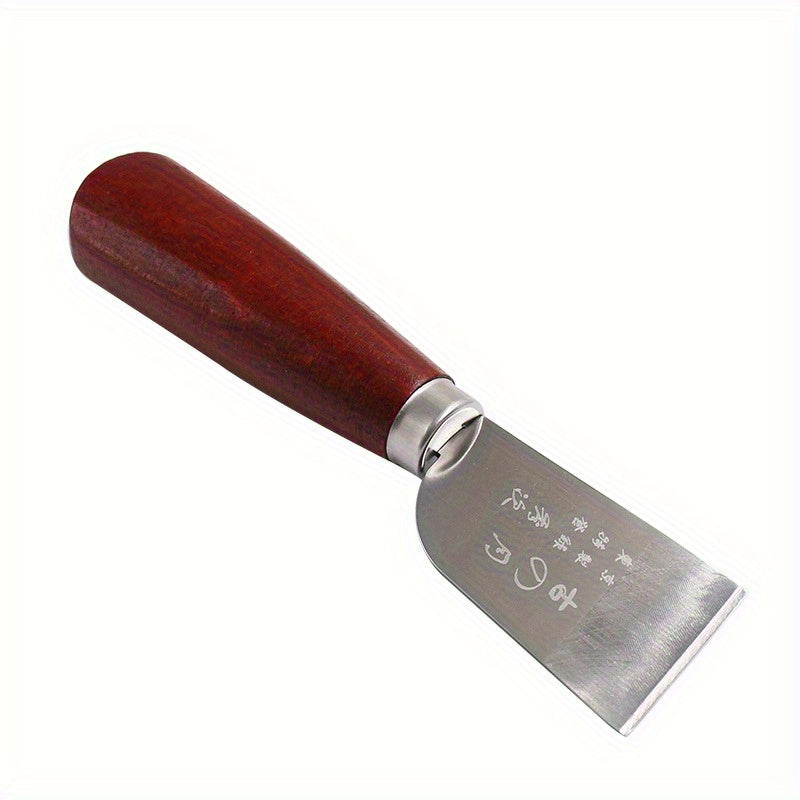 Leather cutting knife with dark wooden handle and crescent steel blade