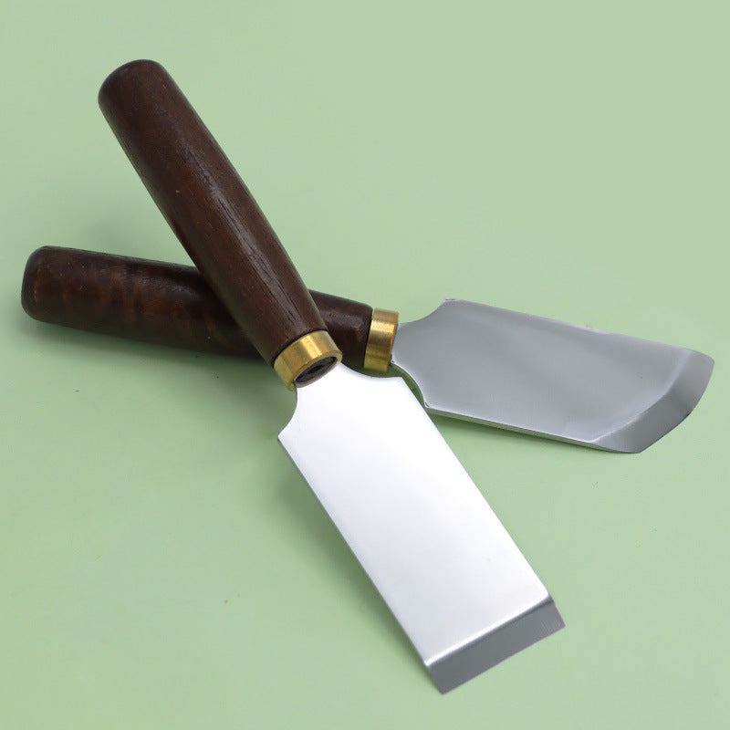 Leather skiving knife set with dark walnut handles, brass rings, and curved steel blades
