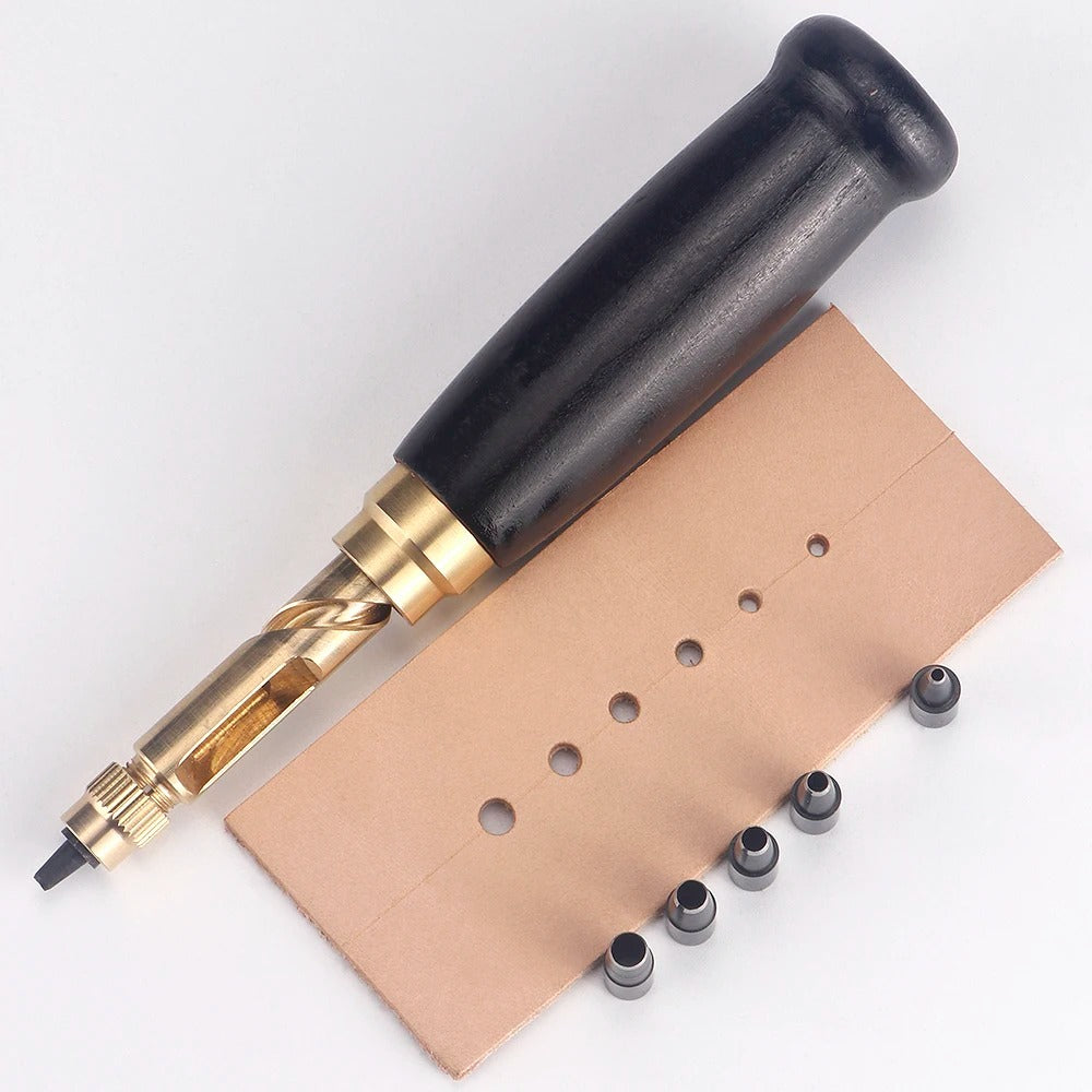 Rotary leather punch tool with black handle and hole-marked tan leather