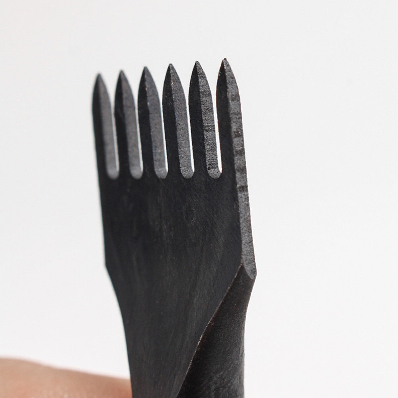 Forked metal chisel tip with five prongs