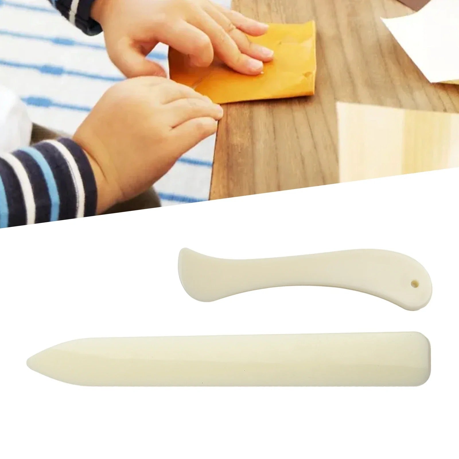 Cream leather bone folder set: one curved tool and one flat-edged tool