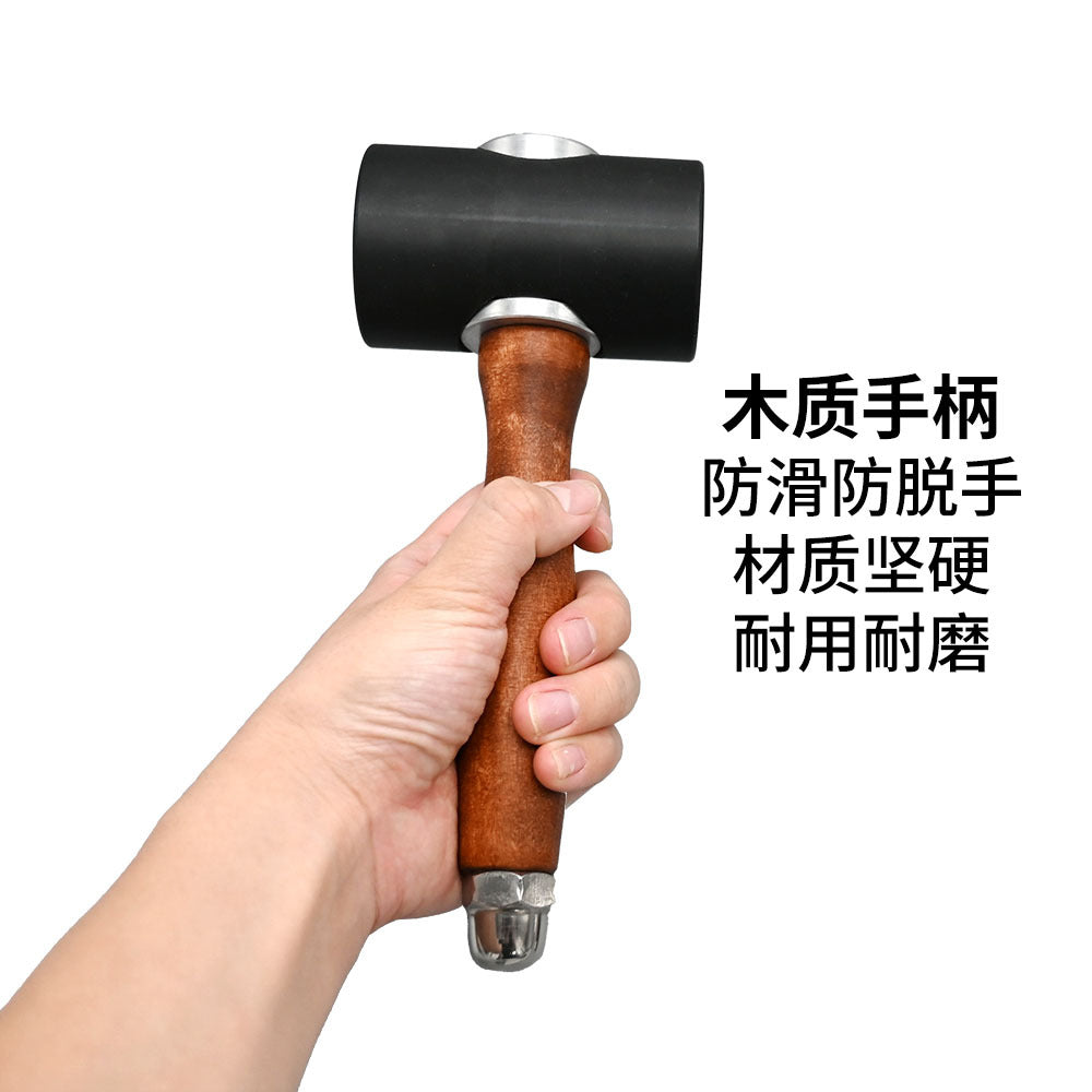 Black T-head nylon mallet with brown wooden handle and silver metal end cap