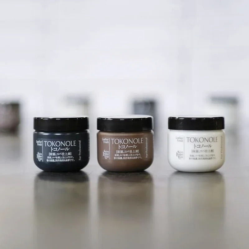 Set of leather finish jars with black lids: dark, brown, and clear