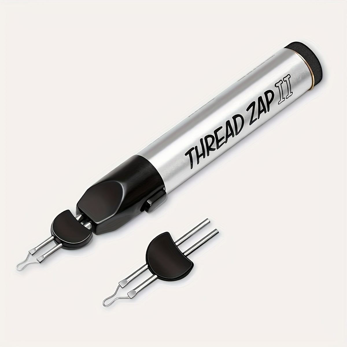 Thread burner pen with silver body and black nozzle, two metal prong tips