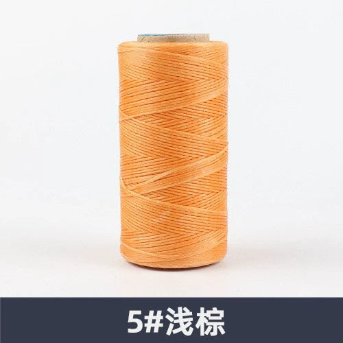 Orange waxed polyester sewing thread spool, flat 150D