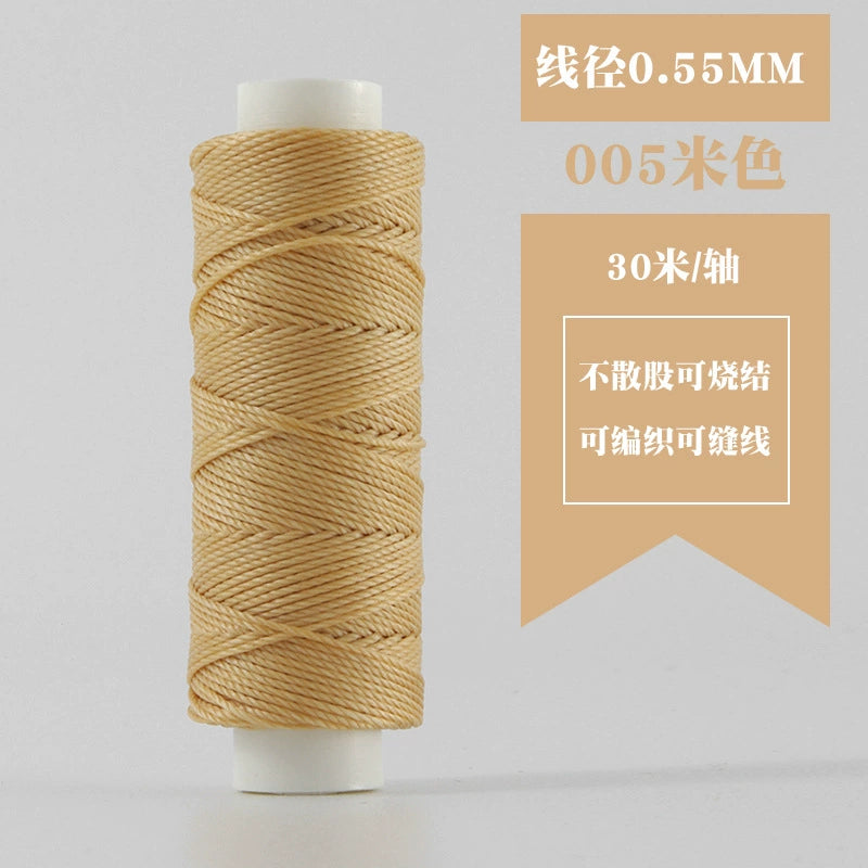 Beige waxed round thread spool
