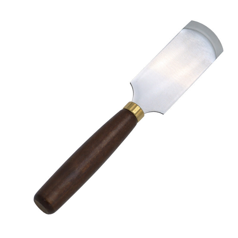 Leather skiving knife with dark walnut handle, brass ferrule, and curved steel blade