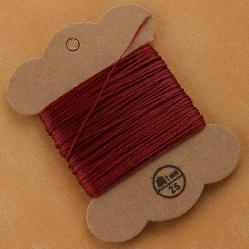 Flat waxed polyester thread spool, burgundy red, 1mm on cardboard card