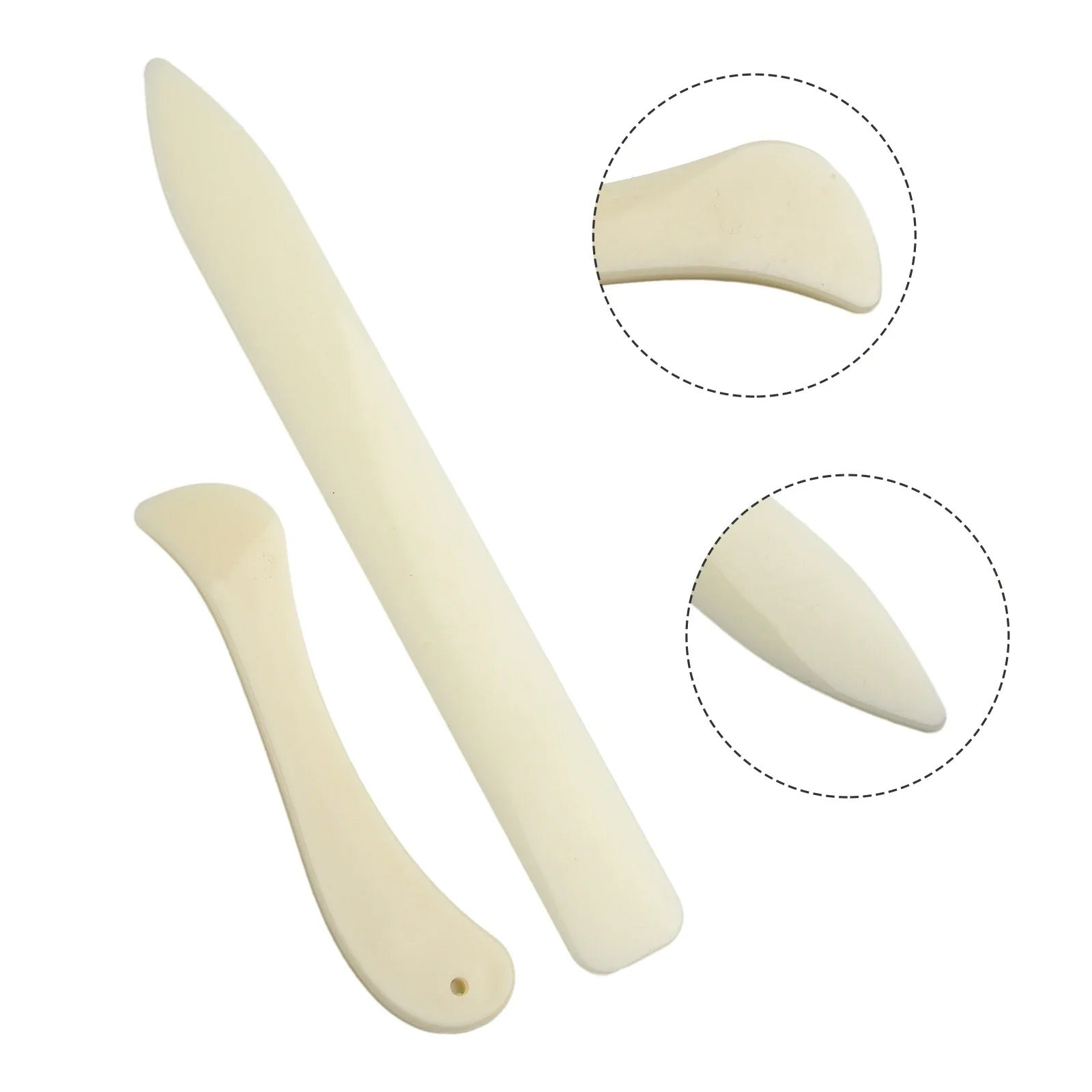 Set of cream leather bone folders with curved tips and small hole details