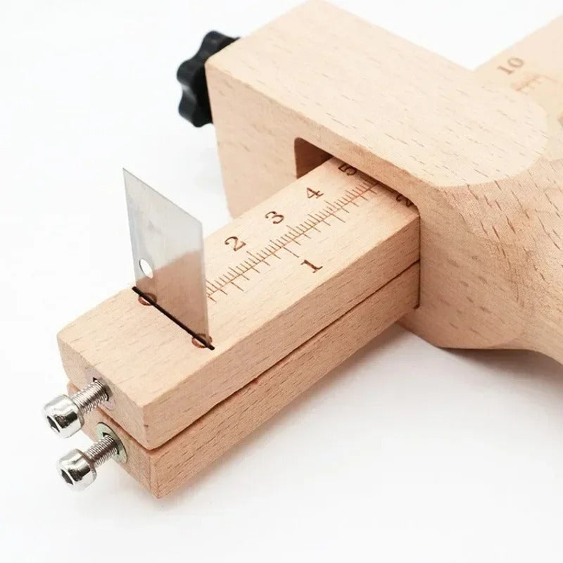 Wooden leather strap cutter with blade rails and tape-style ruler measurement