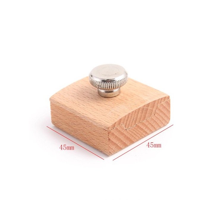 Square sanding block with silver metal knob and beveled edges