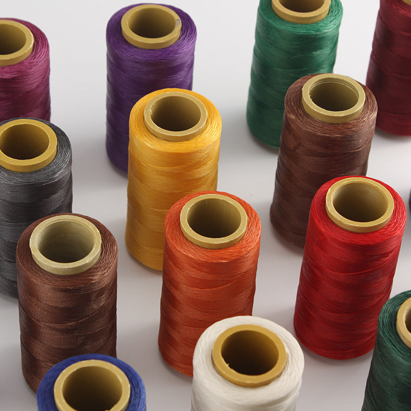 Assorted colored waxed polyester thread spools, visible multiple colors