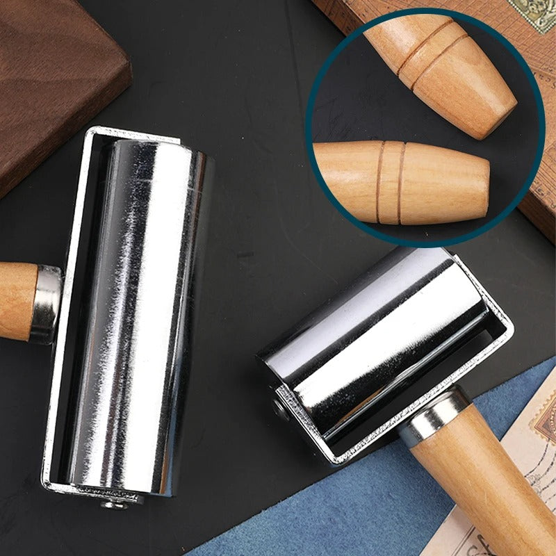 Leather roller press with chrome roller and light wood handle, with leather panel