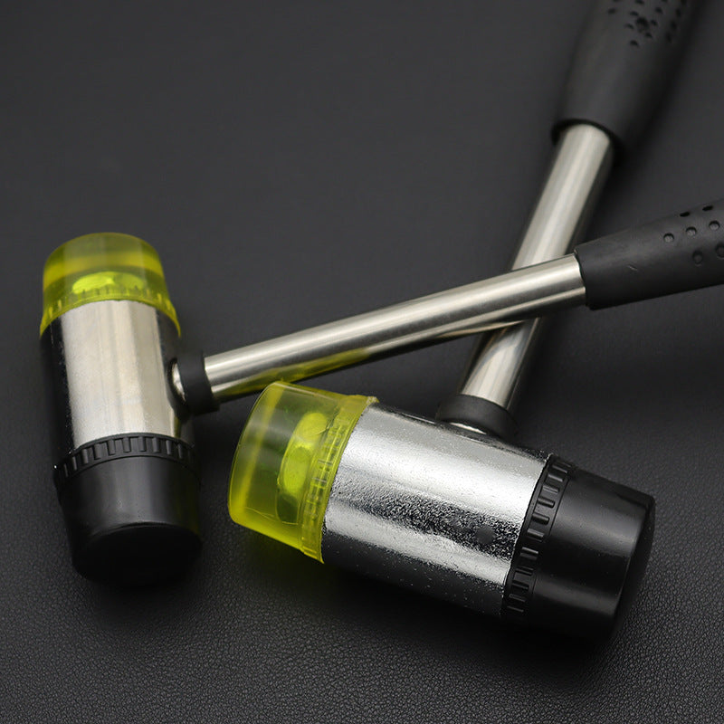 Rubber mounting hammer with steel shaft and removable black-and-yellow soft-face heads