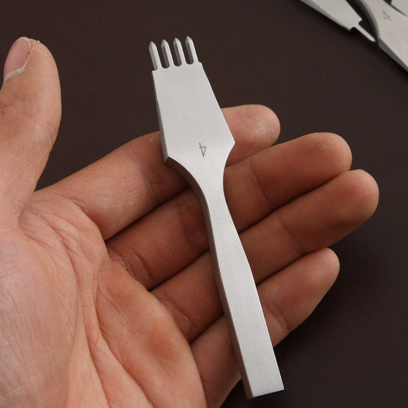Leather hole punch chisel held in hand, white steel with four-tine tip