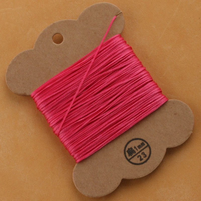 Flat waxed polyester thread spool, hot pink, 1mm on cardboard card