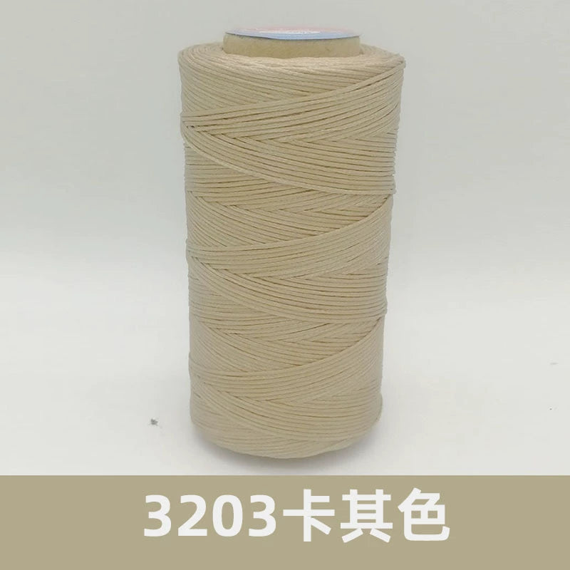 Waxed polyester sewing thread spool, light beige/cream